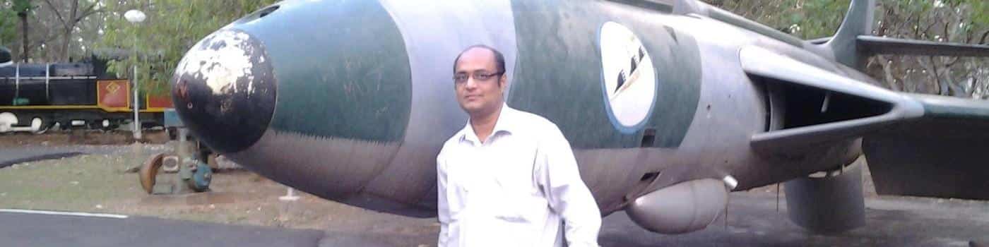 man standing in front of a large airplane, emphasizing supply-chain security